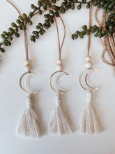 Load image into Gallery viewer, Three gold crescent moon charms with cotton tassels 
