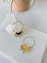 Load image into Gallery viewer, A pair of gold plated 30mm hoop earrings with a rising moon charm 
